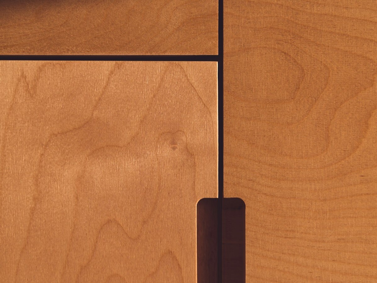 black metal stand on brown wooden floor